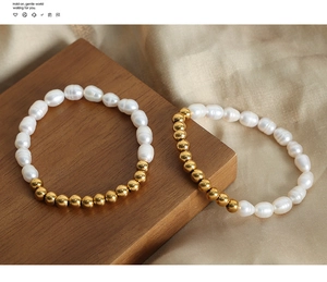 Detailed macro of natural freshwater pearls and gold beads on a classic beaded bracelet