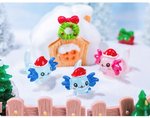 Miniature Christmas scene with glowing axolotl figurines, a snow house, and a festive tree