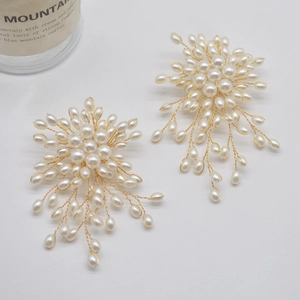 Elegant gold flower tassel earrings with pearls featuring creative handmade floral design