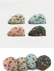 Detailed view of colorful butterfly embroidery on vintage jacquard beret flat caps