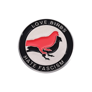 Enamel bird pin badge featuring Love Birbs Hate Fascism text in red and black