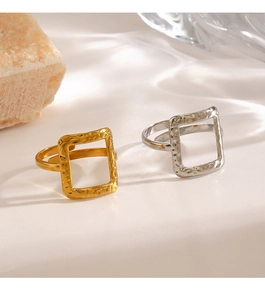 Detail of square hammered texture rings in gold and silver finish with open band