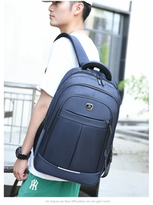 Side view of dark blue business laptop backpack showing layered zipper design