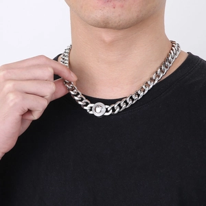 Men's silver Cuban link chain necklace with iced-out diamond clasp on male model