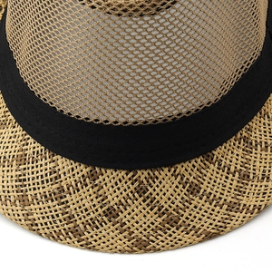 Close-up of breathable mesh crown and classic straw woven brim with black ribbon