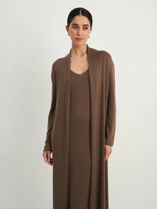 Detail of dark brown knit cardigan and V-neck slip dress showing soft fabric texture