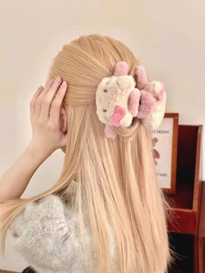 Detail of plush Hello Kitty shark hair claw clip in soft faux fur for elegant styling