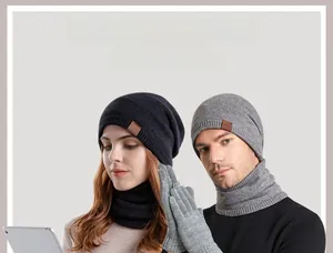 Close-up of winter knitted set featuring beanies, scarves, and touchscreen gloves