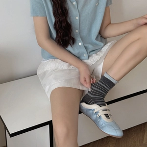 Striped cotton socks in grey paired with light blue cardigan and white lace skirt
