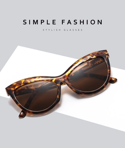 Close-up of tortoise shell frame and brown lenses of retro cat eye sunglasses