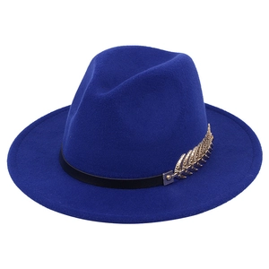 Detail of royal blue wool fedora hat featuring a gold leaf metal accessory on the band
