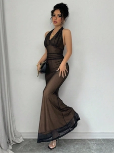 Detail of mesh halter backless fishtail dress showing layered texture and sleek silhouette