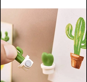 Close-up of 3D green cactus fridge magnets with magnetic white base for notes