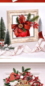 Close-up of Christmas velvet wire ribbon with Merry Christmas text and pine cone decor