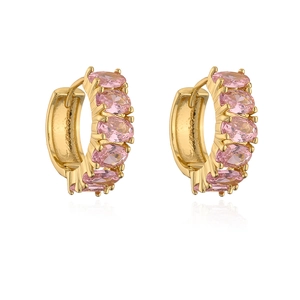Macro detail of gold-plated hoop earrings with oval pink zircon stones and symmetric design