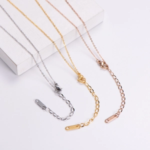 Detail of stainless steel extender chains in silver gold and rose gold with 18KGP tag