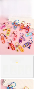 Close-up of colorful acrylic keychains with cartoon prints and charms for bags