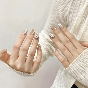 Champagne cat-eye press-on nails with sparkling rhinestones and pearls on long square shape