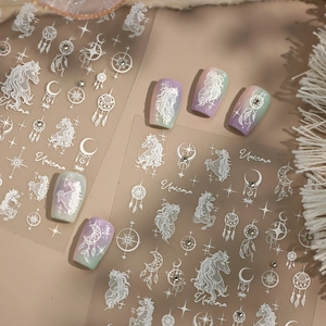 Unicorn dreamcatcher nail art stickers with white star and moon decals on pastel nails