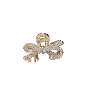 Chic gold-plated bow hair claw clip with sparkling rhinestones for stylish women