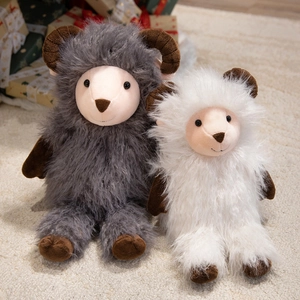 Cute plush sheep toys in grey and white colors with soft long-hair texture on a cozy carpet