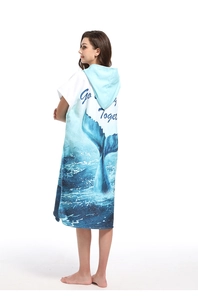 Detail of hooded beach robe featuring a blue whale tail print and soft microfiber texture
