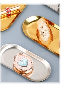 Oval stainless steel trays in gold and silver finish for jewelry and cosmetics storage