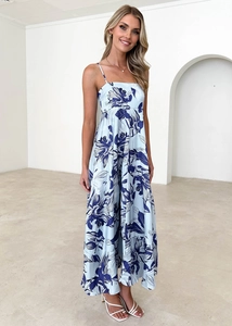 Detail of light blue floral bohemian maxi dress with delicate spaghetti straps