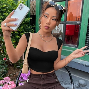 Close-up of black ribbed knit crop top with a square neckline on a model