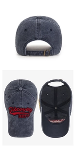 Detail of washed charcoal baseball cap with Discovery BET embroidery and metal buckle