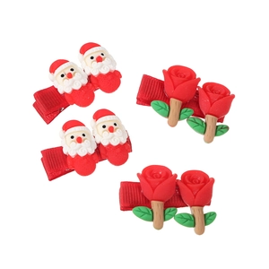 Set of 4 Christmas hair clips featuring Santa Claus and red roses on duckbill clips