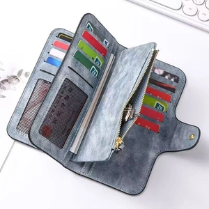 Detail view of the multi-slot interior and vintage faux leather texture of the long wallet