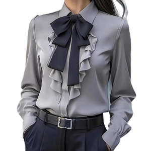Elegant grey long sleeve shirt for women featuring a black bow tie and ruffle details