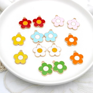 Colorful enamel sunflower alloy pendants for DIY necklace jewelry making on ceramic plate