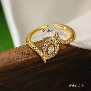 Macro detail of gold geometric open ring with marquise zircon and size specs