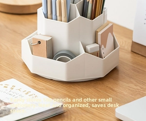 Close-up of white rotating multi-compartment plastic organizer holding 180 pencils
