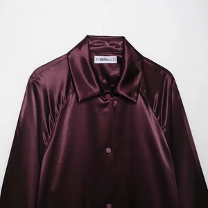 Elegant burgundy satin long sleeve jacket for women with high-gloss finish and smooth texture