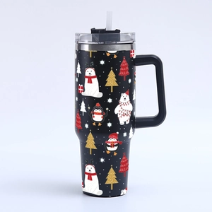 Detail of 40oz stainless steel tumbler with Christmas penguin and polar bear patterns