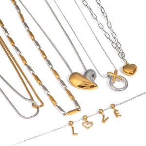 Two-tone stainless steel necklaces featuring heart, XO, and LOVE pendants in gold and silver