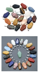Macro view of assorted natural crystal coffin pendants with polished textures for Halloween