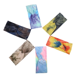 Set of six tie-dye gradient criss-cross sports headbands arranged in a circular layout