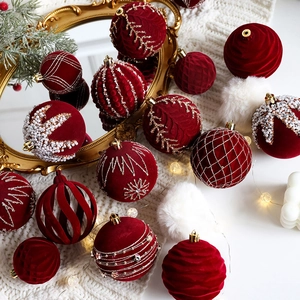 Deep red velvet Christmas ball ornaments with gold thread, pearls, and white sequins