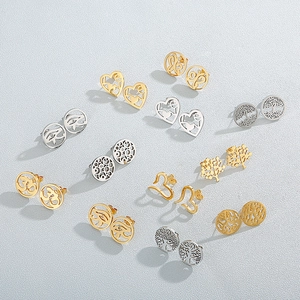 Stainless steel stud earring set with tree of life and heart designs in gold and silver
