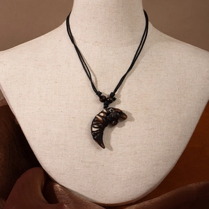 Maori style resin fish hook pendant necklace with brown carved animal design and black cord