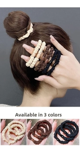 Close-up of three elastic scrunchies in beige, coffee, and black with decorative resin beads