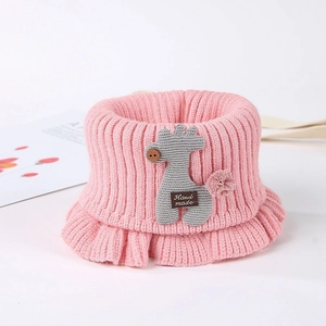 Pink knitted baby neck warmer with a grey giraffe and 'Hand made' label details