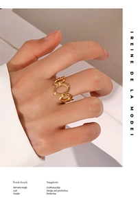 Detail view of model wearing an adjustable 18K gold-plated oval cutout ring in minimalist style