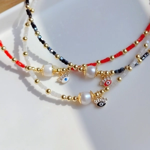 Collier en perles d'eau douce fait main avec pendentifs mauvais œil et perles cristal