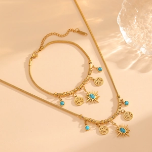 Golden stainless steel jewelry set with tree of life pendants and turquoise beads