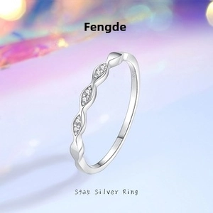 Macro shot of S925 sterling silver ring showing the inner hallmark and wavy diamond band